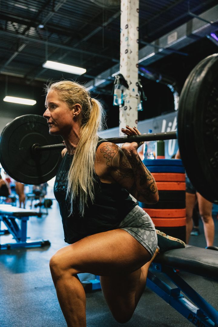 TitanUp member back squatting under the platform